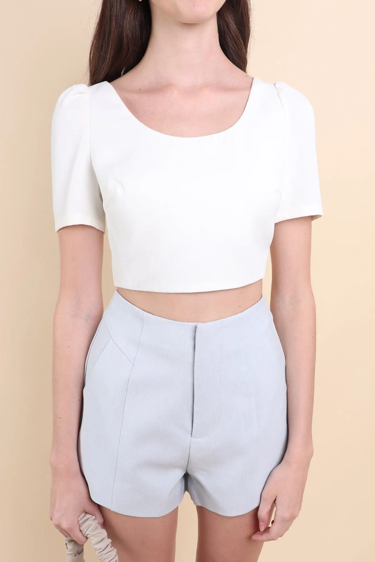 BEBE PADDED BOW OPEN BACK TOP IN WHITE
